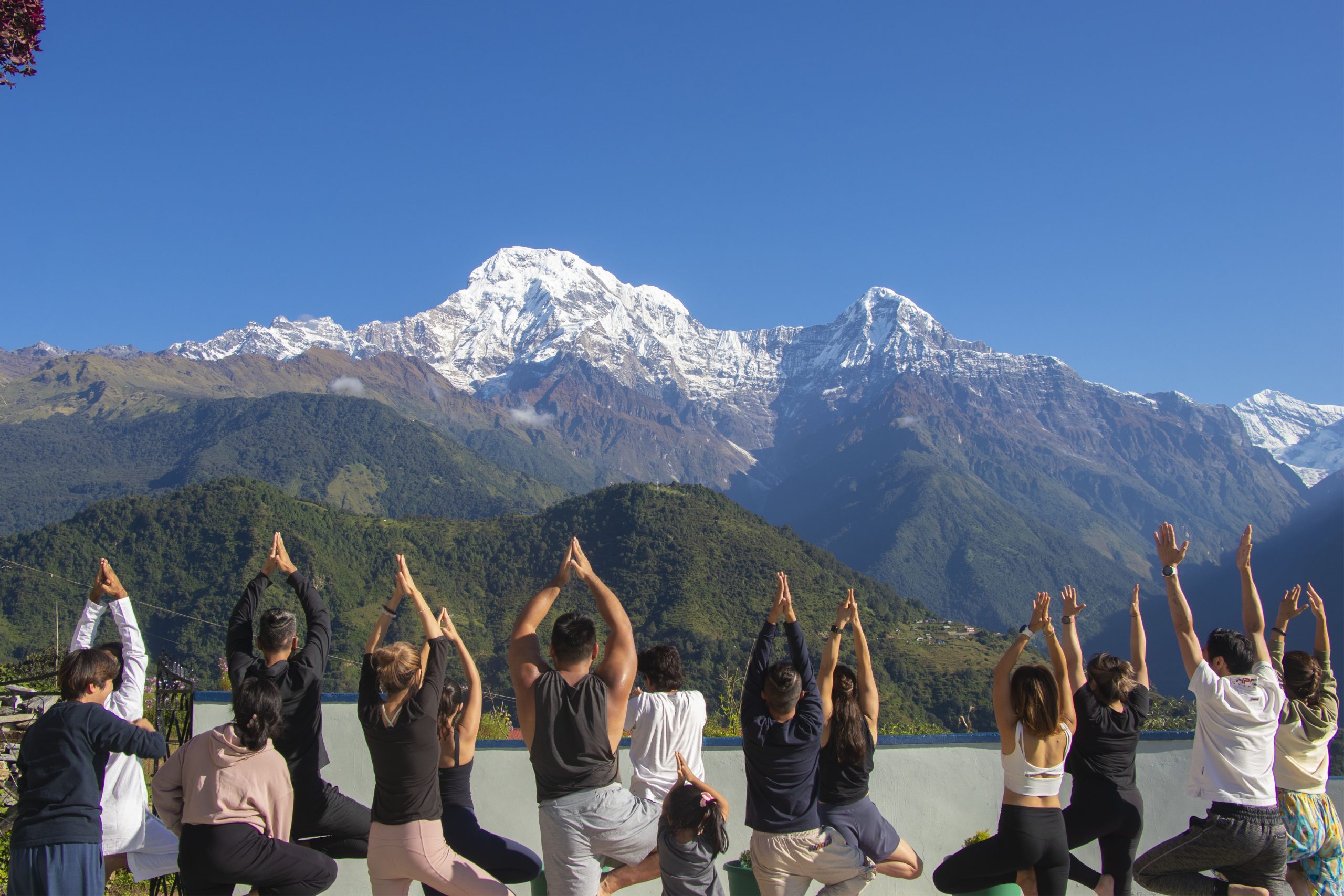 Master Akash Banjara teaching a yoga class with calm focused presence.